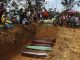 Relatives mourn at the site of a mass burial at the Nossa Senhora Aparecida cemetery, in Manaus, Amazonas state, Brazil